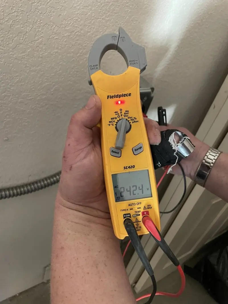 Voltage testing with clamp meter during Recessed Lighting Installation in Forest Hill